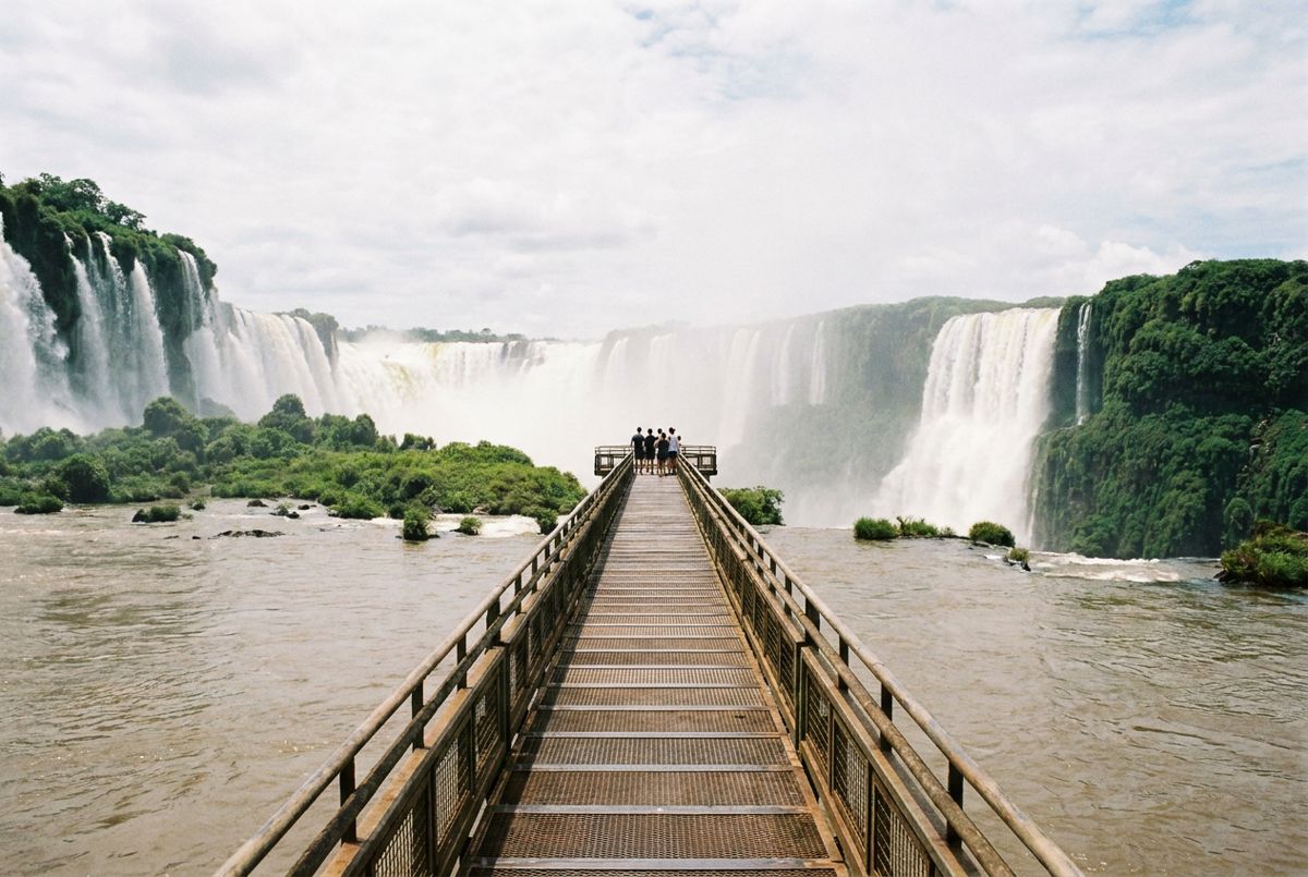 Walkway leading over the river to the misty Devil's Throat falls on the Argentine side