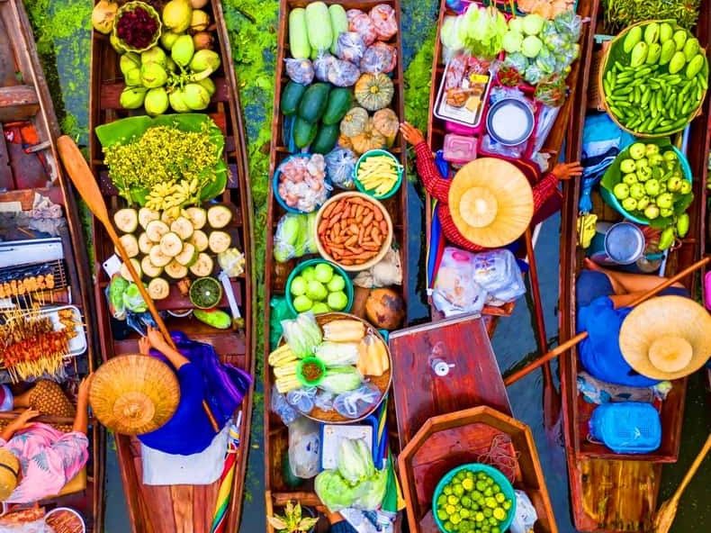 Boats loaded with fruit and vegetables at a Thai floating market