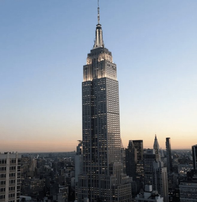 The Empire State Building rising above Midtown at dusk