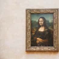 The Mona Lisa behind glass at the Louvre