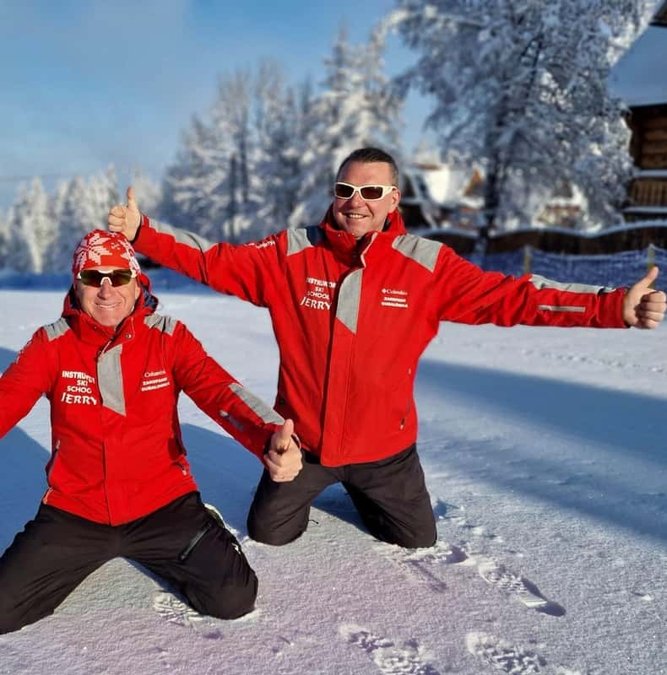 Ski instructors kneeling in the snow on Gubałówka Hill