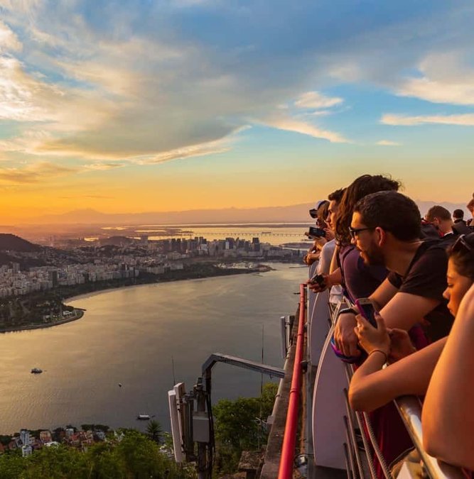 Visitors watching the sunset from Sugarloaf Mountain