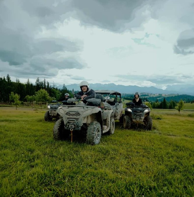 Quad bikes lined up on a mountain meadow near Zakopane
