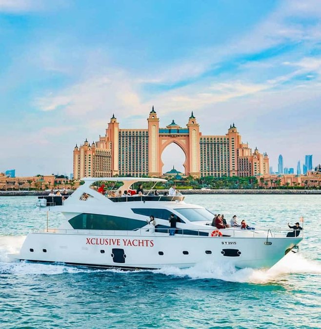 Yacht sailing past the Dubai Marina towers