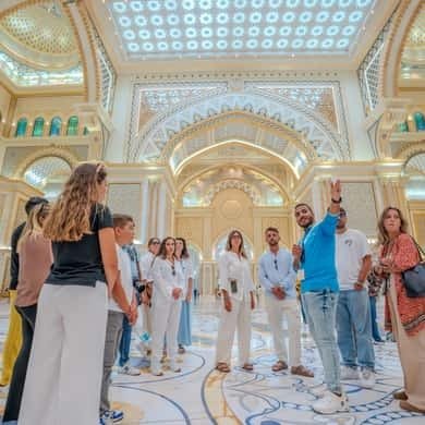 Tour group inside the great hall of Qasr Al Watan palace