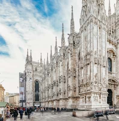 White marble facade and spires of Milan Cathedral