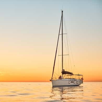 Sailboat on the Barcelona coast at sunset