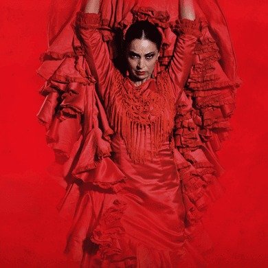 Flamenco dancer in a red dress on stage