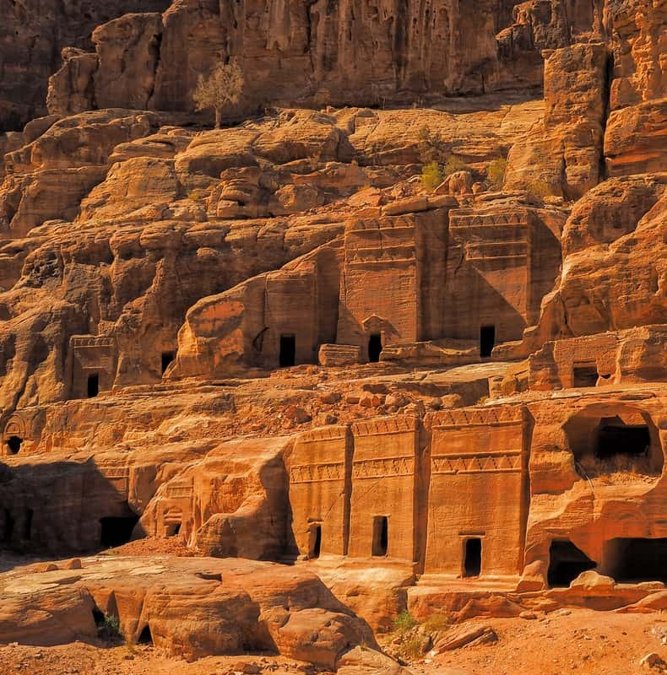 Carved Nabataean tombs in the sandstone walls of Petra