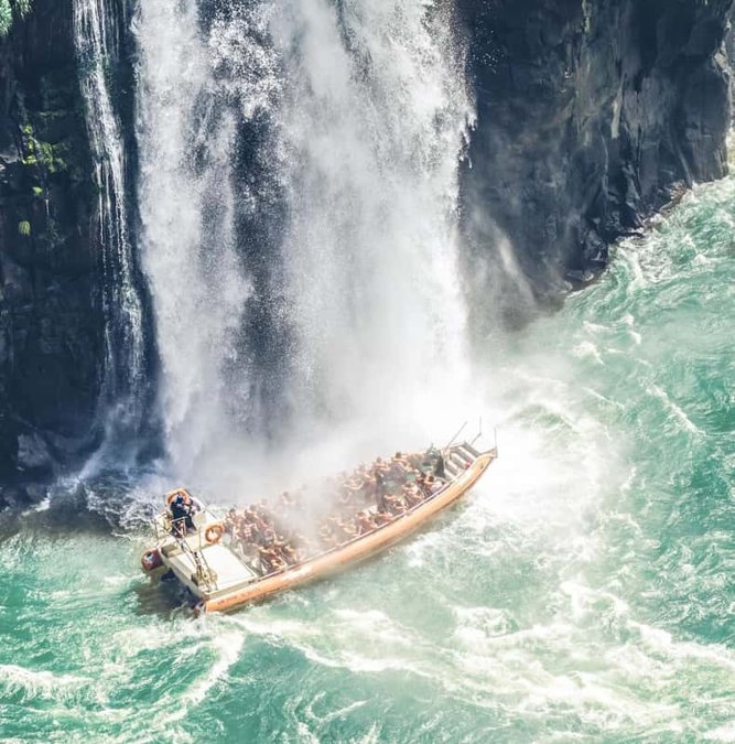 Speedboat heading into the spray of Iguazu Falls