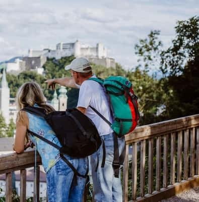 Travelers looking over the river toward Salzburg