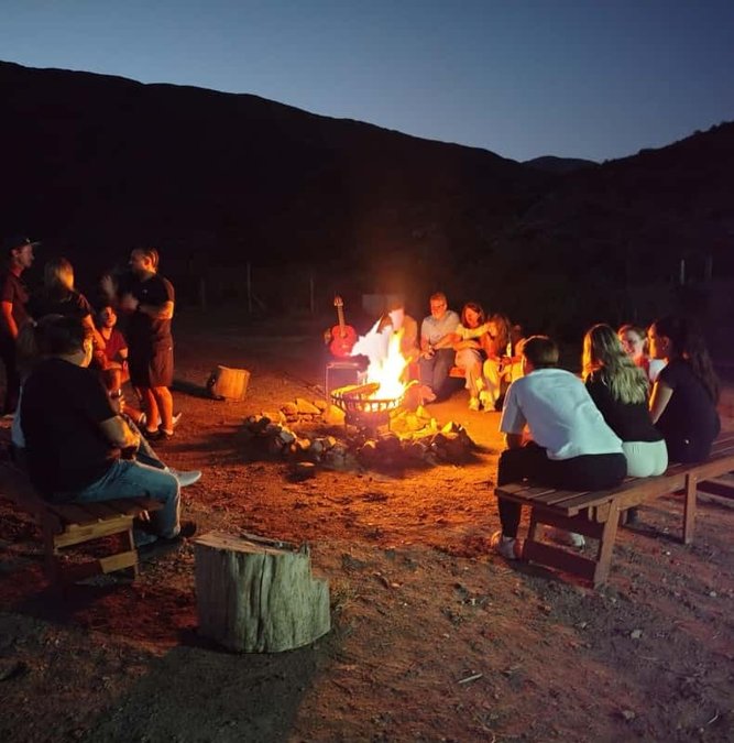 Campfire asado after a horseback ride at dusk