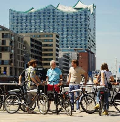 Cyclists beside the Elbphilharmonie in Hamburg