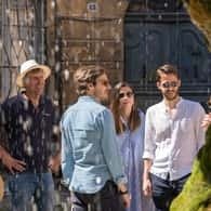 Small group in front of a stone wall in Aix-en-Provence