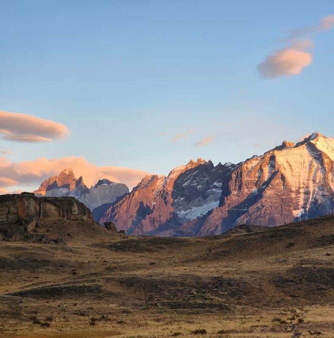 Trail through golden grass toward the Paine mountains