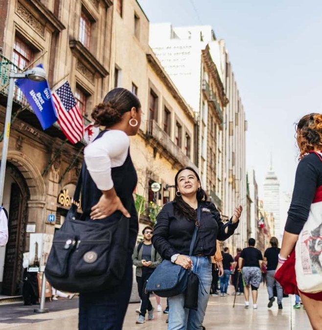 Walking tour group on a street in Mexico City's historic center