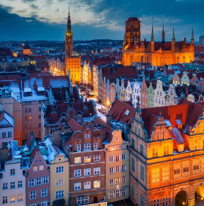 Rooftops and St. Mary's Church of Gdansk at dusk