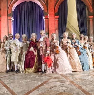 Musicians in 18th-century costume on stage in Venice