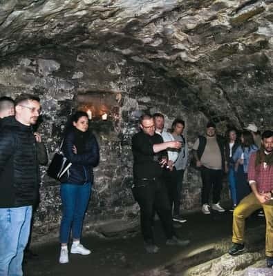 Tour group in the stone vaults beneath Edinburgh