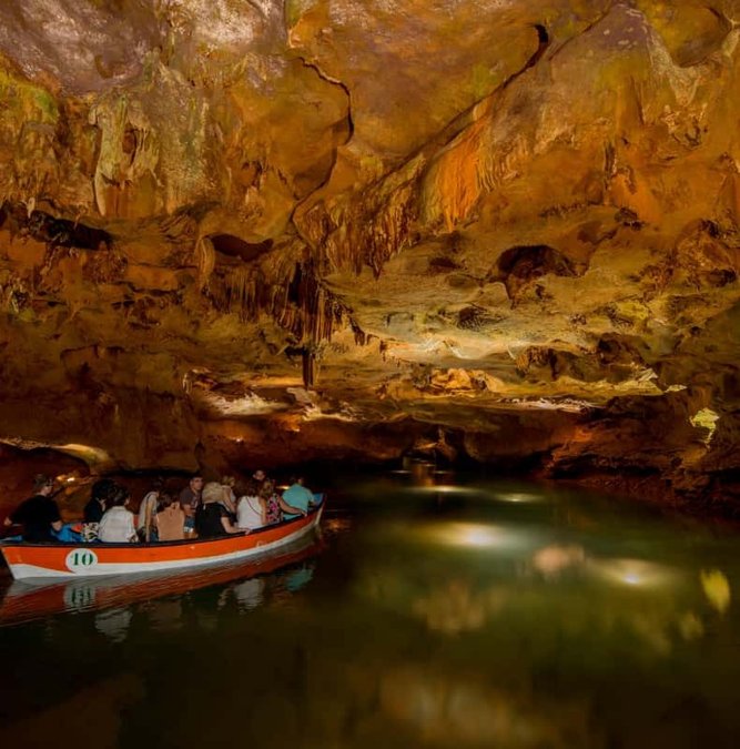 Boats inside the underground river of the Caves of San José