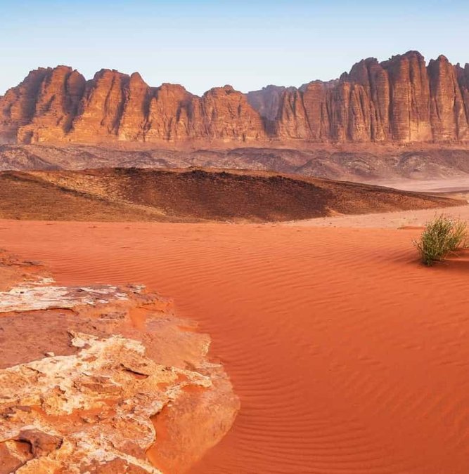 Red sand and sandstone mountains of Wadi Rum from above