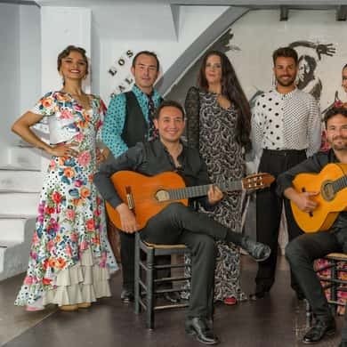 Flamenco dancers and guitarists on stage at Los Gallos