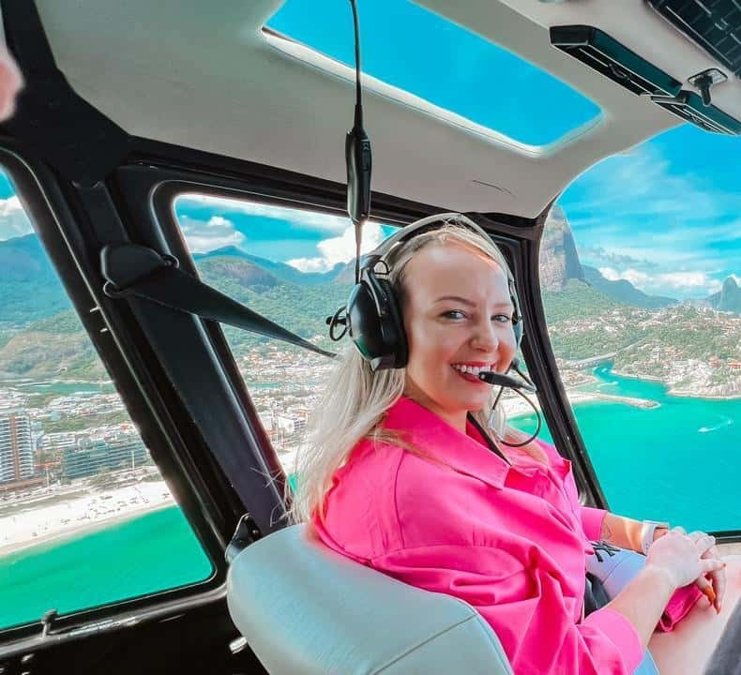 Passenger in a helicopter above the Rio coastline