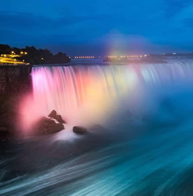 Niagara Falls illuminated in colors at night