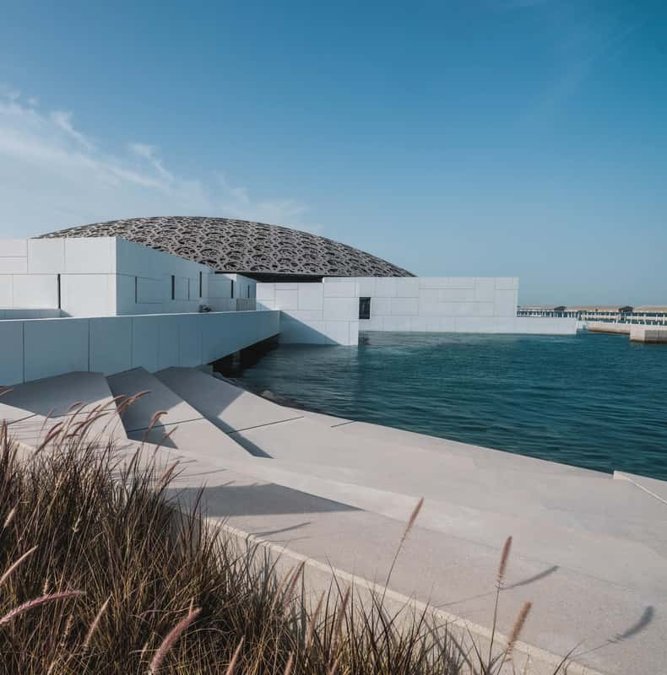 Perforated dome of the Louvre Abu Dhabi above the water
