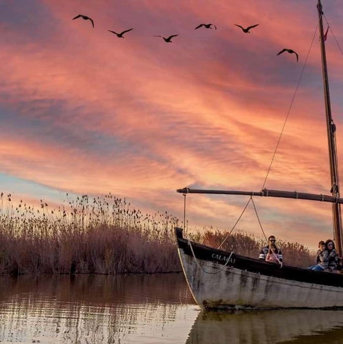 Boat on the Albufera lagoon at sunset