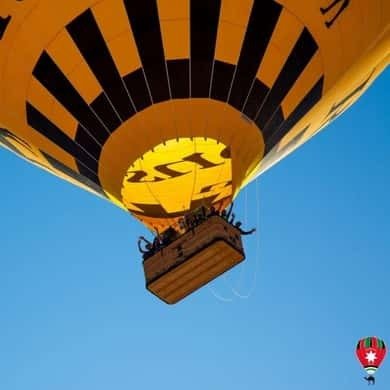 Hot air balloon basket rising over the Wadi Rum desert