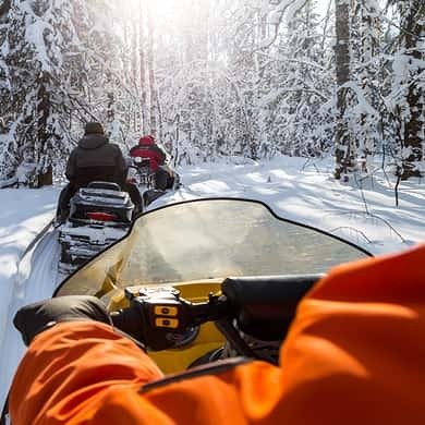 Snowmobile rider on a snowy track in the Tatra foothills