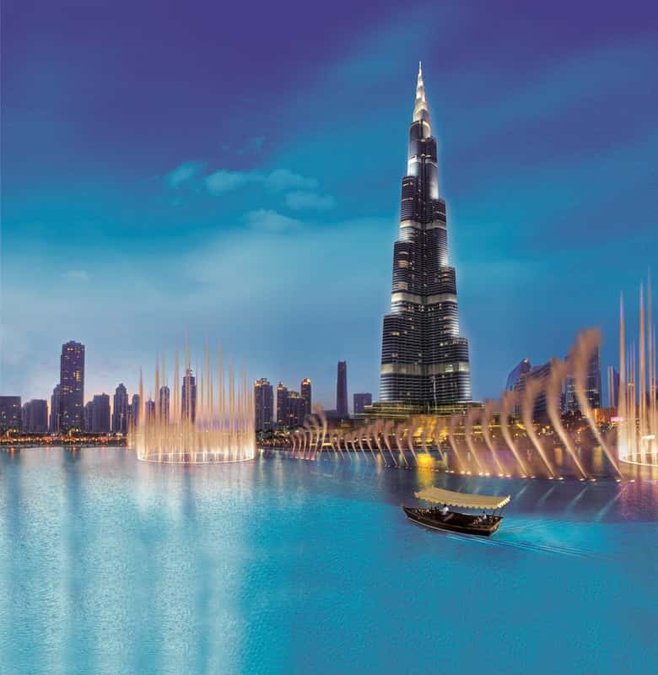 Dubai Fountain jets lit up in front of the Burj Khalifa