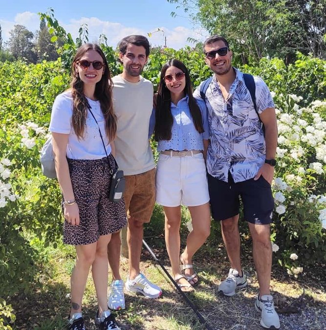 Small group among the vines on a Mendoza winery tour