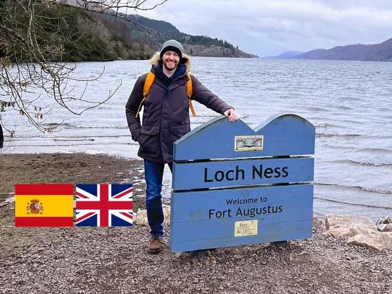 Loch Ness under dark clouds with hills either side