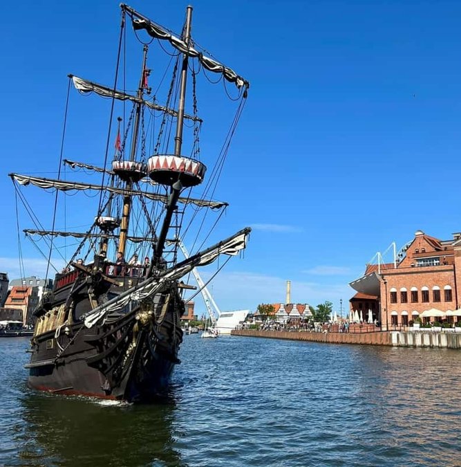 Replica pirate galleon sailing out of Gdansk toward Westerplatte