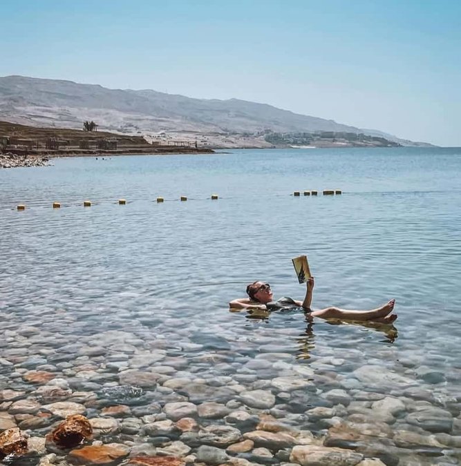 Dead Sea beach with mountains across the water