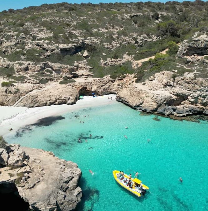 Turquoise cove of Caló des Moro from the sea