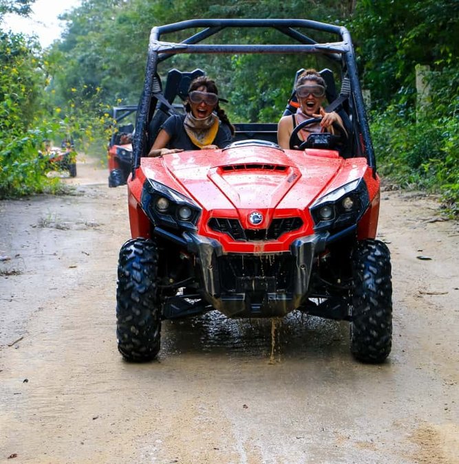 Red buggy on a jungle track in the Riviera Maya