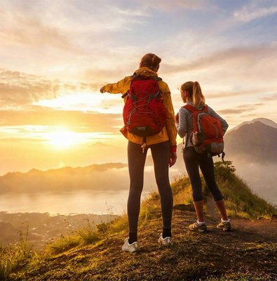 Hikers overlooking sunrise at Mount Batur, Bali.