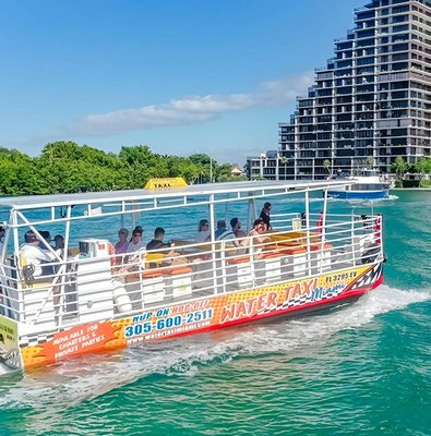 Water taxi cruising near high-rise buildings in Miami.