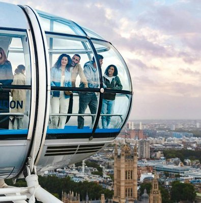Guests enjoying views from the London Eye capsule over the city skyline.