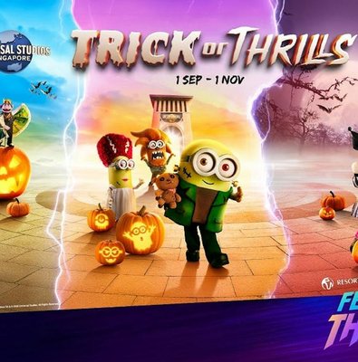 Universal Studios Singapore Trick or Thrills event with costumed characters and pumpkins.