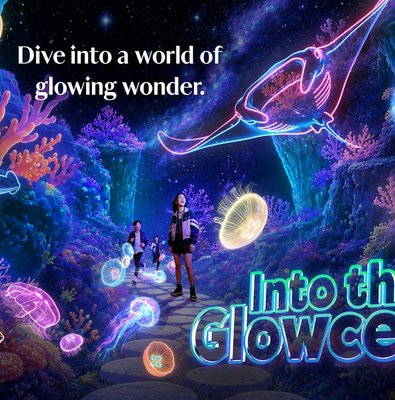 Visitors exploring glowing marine life at Into the Glowcean, Resorts World Sentosa.