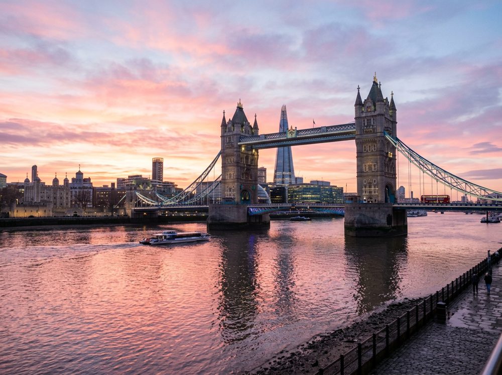 Tower Bridge at dawn with soft pink light on the Thames